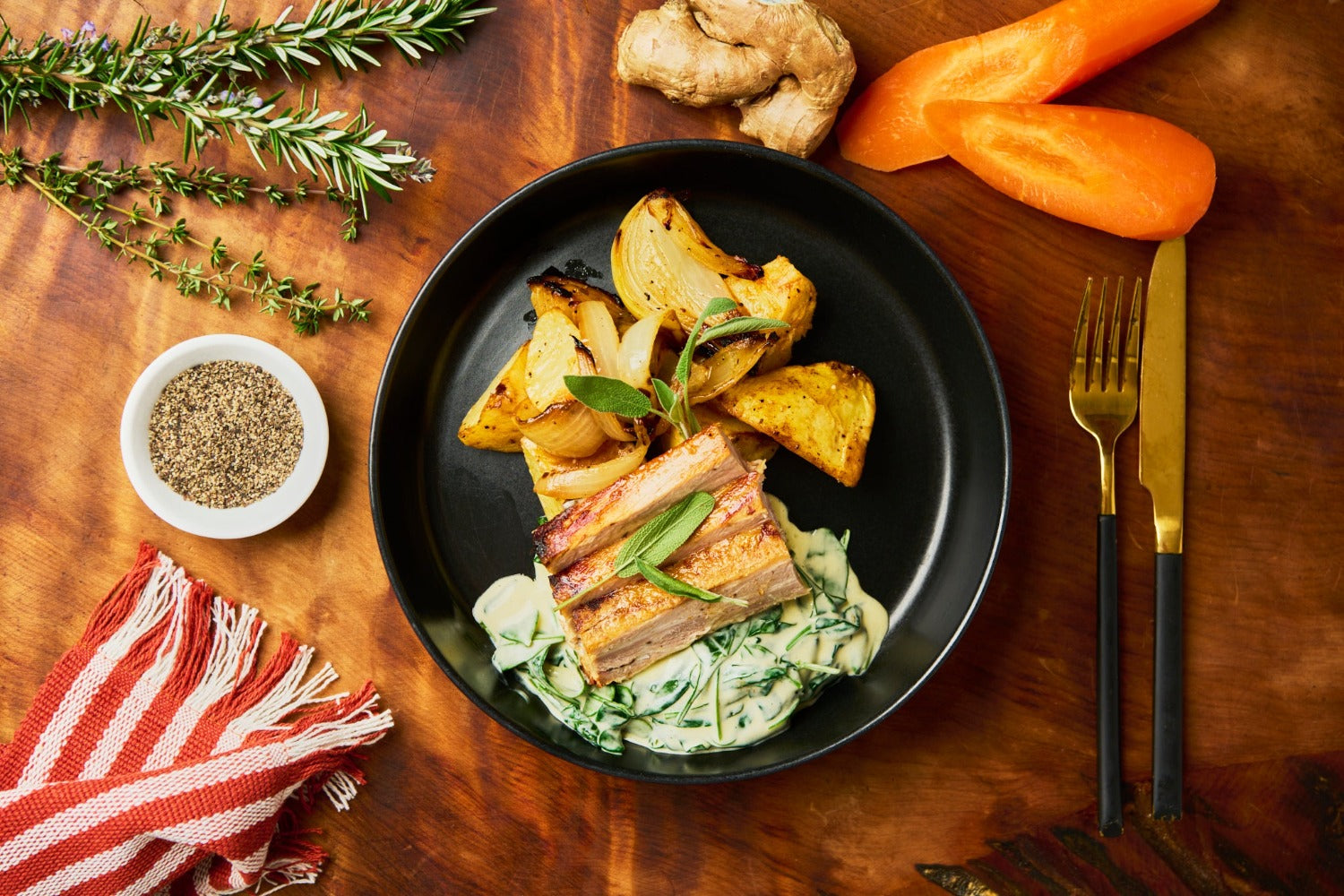 Slow-roasted pork belly with paprika and garlic roast potatoes