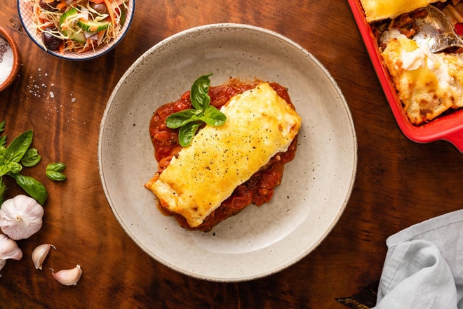 Cheesy pork lasagne with tomato and basil ragu