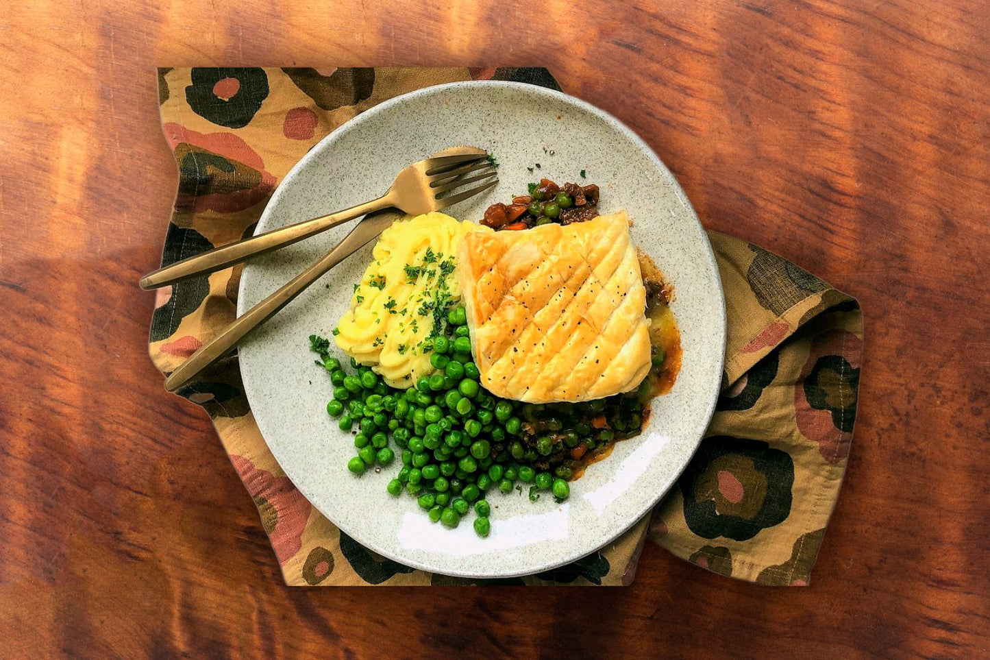 Steak and cheese hotpot with puff pastry topping